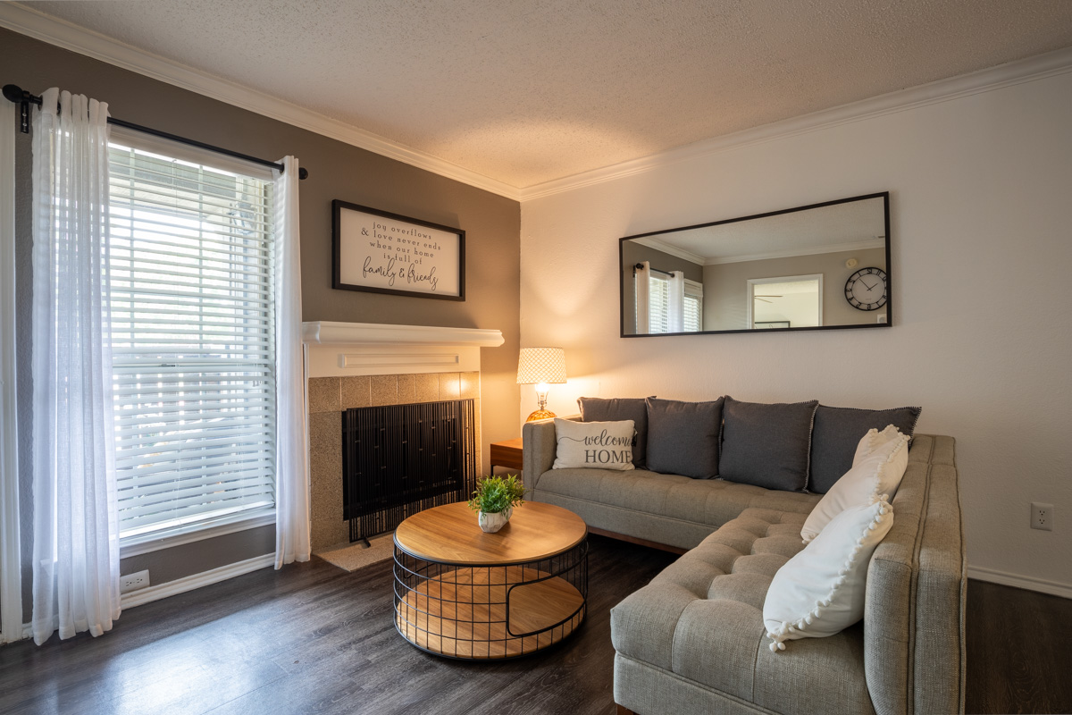 a living room filled with furniture and a window