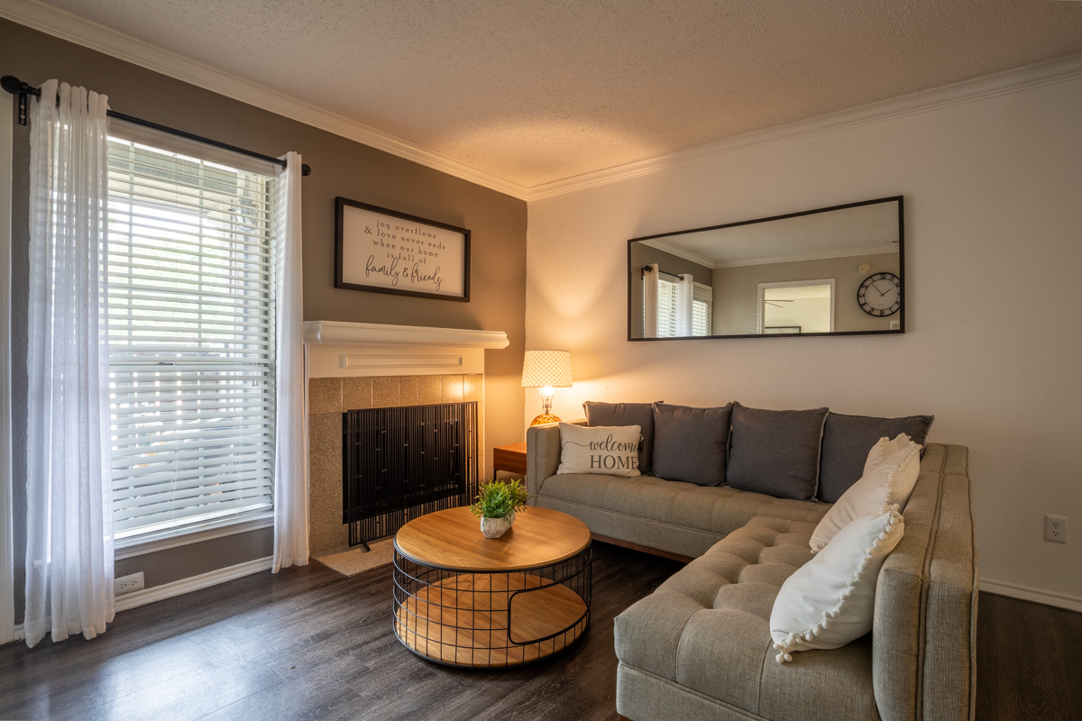 a living room filled with furniture and a window